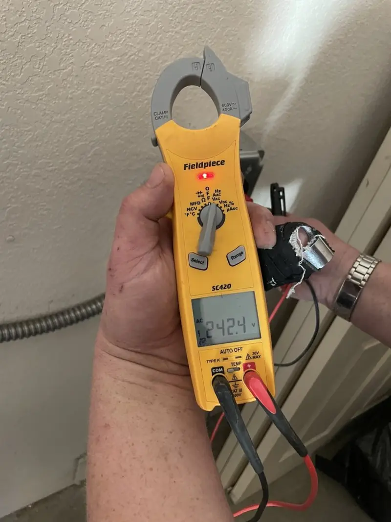 Voltage testing with clamp meter during Whole House Surge Protector in Sammamish